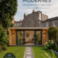 Une pièce de jardin moderne avec des fenêtres panoramiques intégrées dans un espace vert luxuriant.