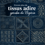 Tissu Adire vintage, coloré et fait main, exposé sur une table.