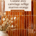 Cuisine chic avec carrelage zellige marron et orange, ambiance chaleureuse.